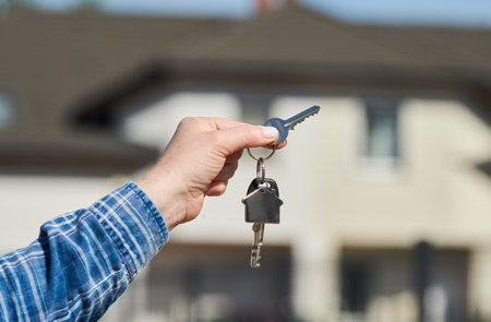Hand with house keys. rent, purchase or sale real estateの写真素材