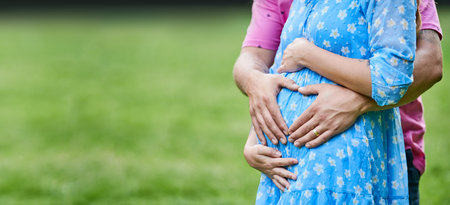 motherhood and pregnancy. hands on pregnant woman belly. Baby expectationの写真素材