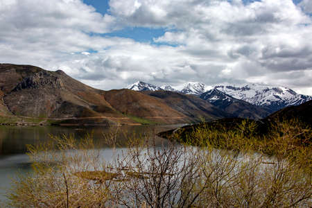 snowy mountain and green filed in turkeyの写真素材