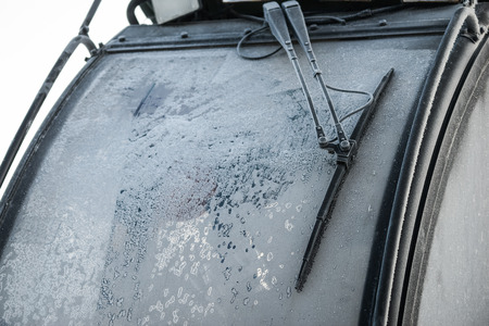 Frozen tractor window texture freezing ice glass background.の写真素材