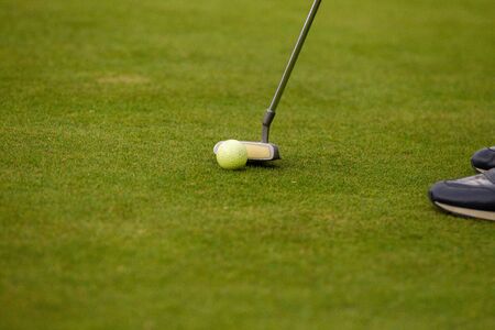 Player a during a golf game during a hitの写真素材