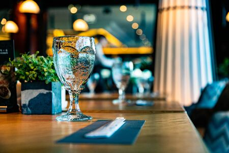The glasses on a table in a restaurantの写真素材
