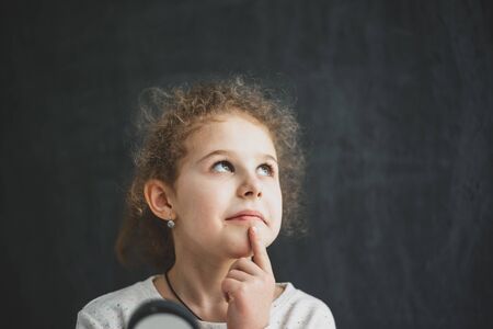 girl studying objects with a magnifierの写真素材