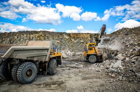 Production Mining of granite stone by quarrying machines in Mikashevichiの写真素材