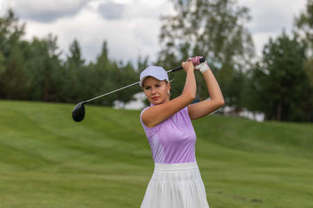 Golfer hits with a club during the tournamentの写真素材