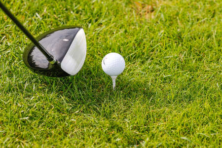 Golf ball in golfers hand.