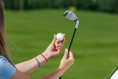 Golf ball in golfers hand.の写真素材