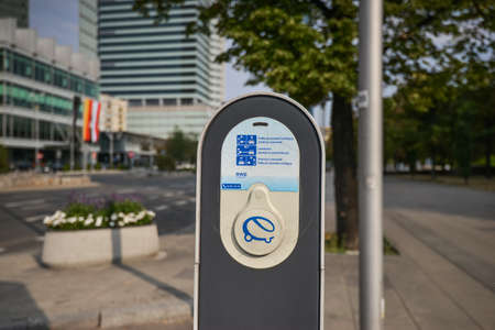 WARSAW. POLAND - AUGUST 2015: Charging station for an electric car in the city center against the background of a flower bed and a road.のeditorial素材
