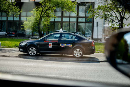 WARSAW. POLAND - June 2016: Taxi on the streets of Warsaw, Poland. Traffic on the roads, taxi cars carry a passengers.のeditorial素材