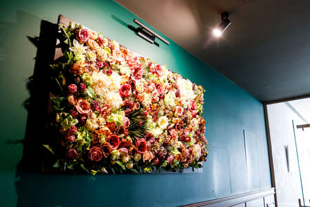 Artificial Flower Wall Wall Flowers Decoration Rose Silk Flowers in the luxury spa center against a...
