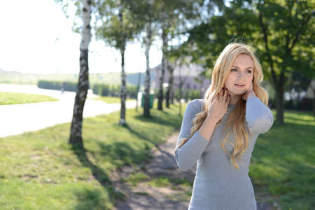 Girl meets sunrise on the river bank. High quality photoの写真素材
