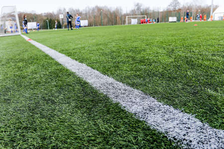 Green grass on outdoor stadium, selective focus. sport and games. healthy lifestyle. playing football field.の写真素材