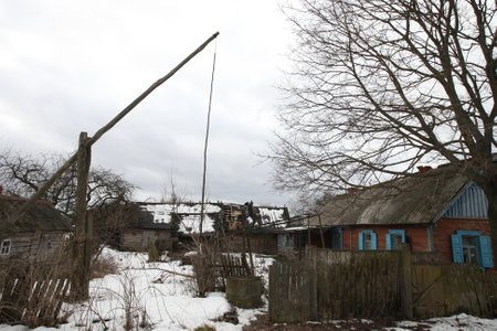 Belarus. Mars Village - 06,02,2011: Abandoned village, village houses, an old well - crane.のeditorial素材