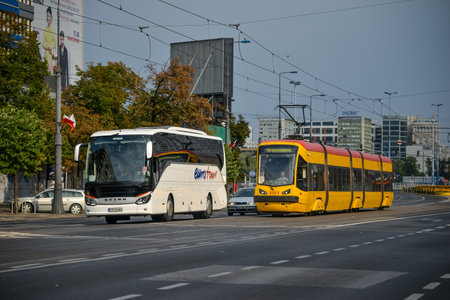 WARSAW. POLAND - AUGUST 2015: Yellow trams on the streets of Warsaw. Warm summer in Warsaw.のeditorial素材