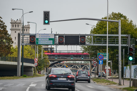 WARSAW. POLAND - AUGUST 2015: Road, speed limit signs, the traffic light shines green. High quality photoのeditorial素材