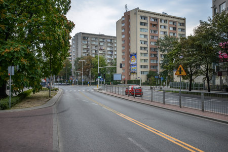 WARSAW. POLAND - AUGUST 2015: Cityscape of Warsaw in summer. Green trees along the road. Residential quarters, high-rise buildings. Warm summer day in Warsaw.のeditorial素材