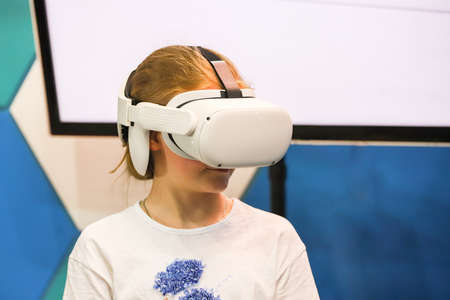 The little girl in virtual reality headset.