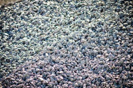 A crushed stone and a sand are materials for making asphalt. Asphalt plant.の写真素材