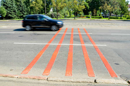 Noise stripes on a road in the city. The car drives along the noise lanes.のeditorial素材