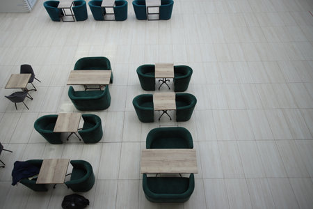 Food court, tables and a soft green chairs on the food court.の写真素材