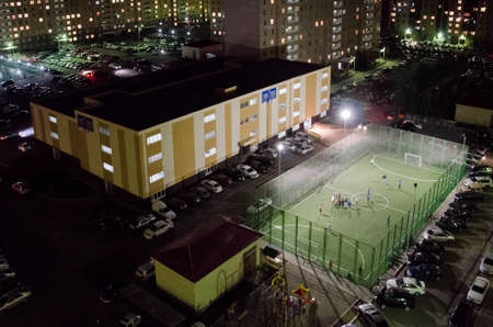 Nur-Sultan. Kazakhstan: 04.09.2013 - stadium, a sports ground in a yellow residential area, a residential complex.のeditorial素材