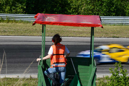 Kaunas. Lithuania - 06.06.2015 - Fans and observers of auto races stand on the side of the track in Kaunas.のeditorial素材