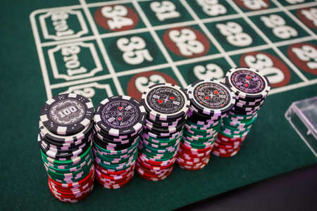 Minsk. Belarus - 25.06.2021 - Playing chips from the casino on a roulette tableのeditorial素材