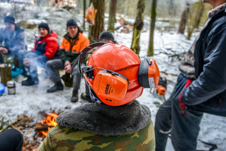 Belarus - 02.02.2015 - A team of lumberjacks is resting at lunchtime in a clearing in a winter forest. High quality photoのeditorial素材