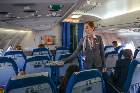 Switzerland - 05.29.2015 - Passengers and journalists on board, a blue seats, flight.のeditorial素材