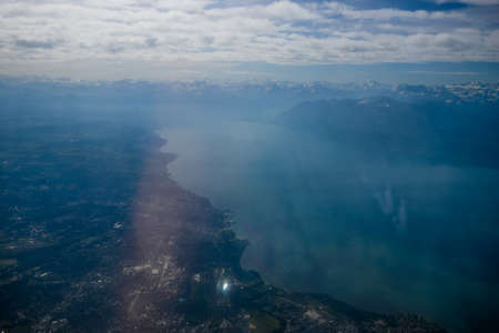 Switzerland - 05.29.2015 - View from the airplane window, Swiss Alps. Mountains, snow, clouds.のeditorial素材
