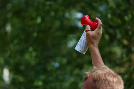Minsk. Belarus- 25.07.2021 - Man signals the start of a golf tournament. High quality photoのeditorial素材