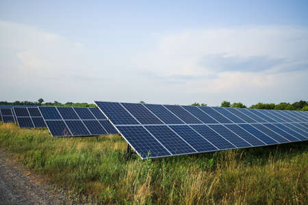 Solar panels fields on a green hills.の写真素材