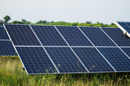 Solar panels fields on a green hills.