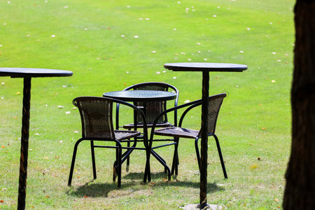 Table and chairs on the golf course. Seating areaの写真素材