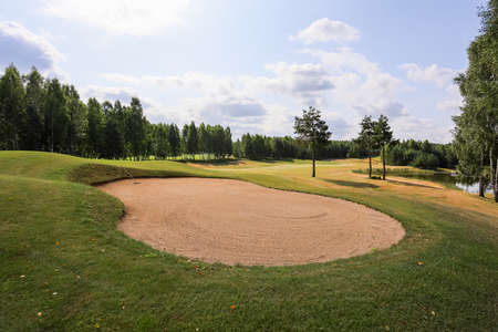 Golf course in the middle of the forest glade.の写真素材