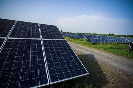 Solar panels fields on a green hills.の写真素材