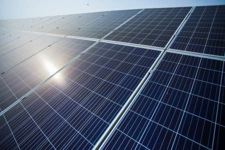 A suns rays fall beautifully on solar panelsの写真素材