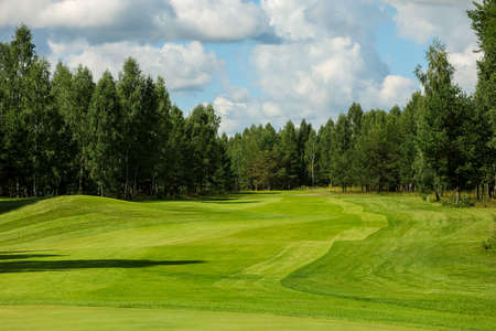 Panorama view of a Golf Course with fairway field. Golf course with a rich green turf beautiful scenery. High quality photoの写真素材