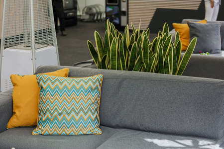Relax, place to rest, gray sofa, a bright accent pillows. High quality photoの写真素材