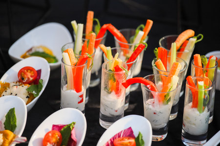 Vegetables in sauce on a buffet table, sweet paprika and carrotsの写真素材