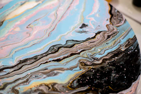 Beautiful abstract background. Golden and dark blue mixed acrylic paints. Marble texture. Contemporary art.の写真素材