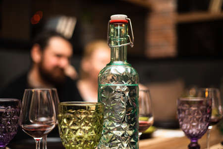 A glass for wine of an unusual shape on a festive table. High quality photoの写真素材
