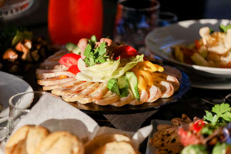 Cold appetizers on the plate on a buffet table. High quality photoの写真素材