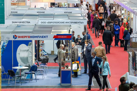 Minsk. Belarus: 12.10.2021 - Visitors walk among the exhibition stands on the Energy Expo exhibition in Minsk.のeditorial素材