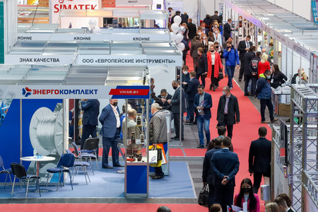 Minsk. Belarus: 12.10.2021 - Visitors walk among the exhibition stands on the Energy Expo exhibition in Minsk.のeditorial素材
