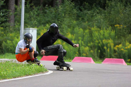 Longboard competition, athletes on the track in the middle of a forest.の写真素材