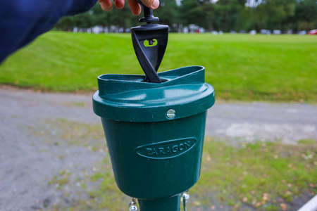 Close up - Golf ball station for washing dirty golf balls. Green background. High quality photoの写真素材