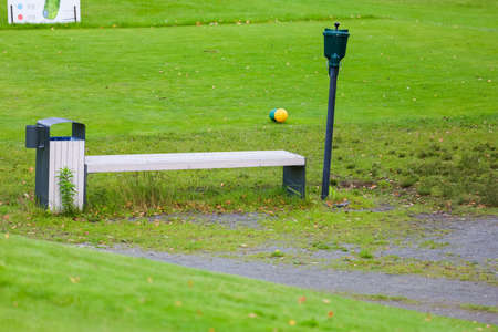 Close up - Golf ball station for washing dirty golf balls. Green background. High quality photoの写真素材