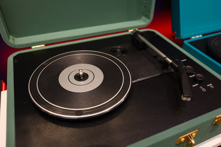 Turntable with vinyl record on wooden background, top view. High quality photoの写真素材