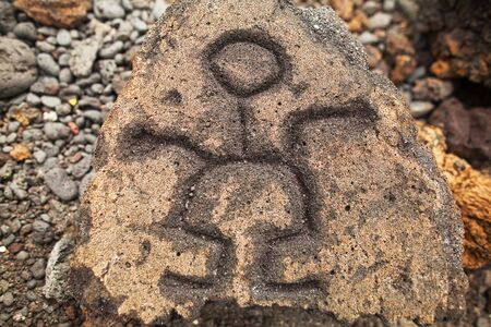 Simple ancient engraving in the stone on Hawaii Islandの写真素材